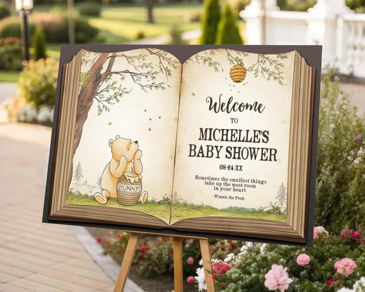 Front view of Winnie the Pooh baby shower sign designed like an open storybook, with elegant typography and forest-inspired background.
