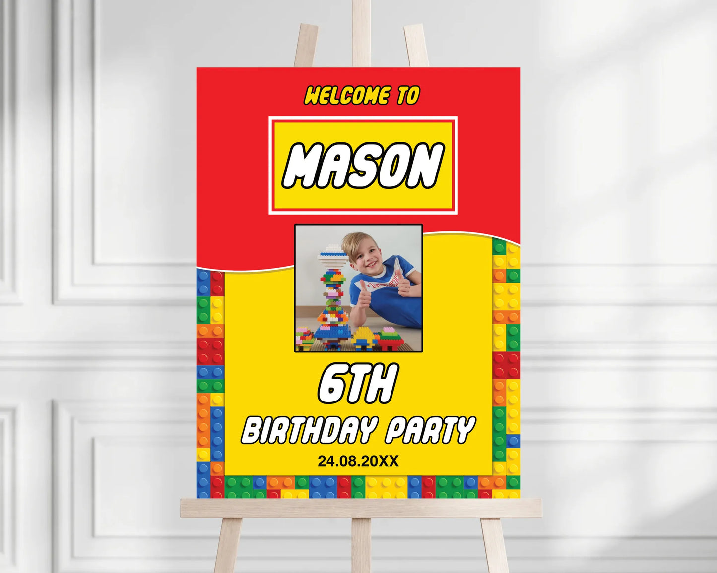 Personalized LEGO birthday party welcome sign with photo placeholder displayed on a wooden easel.