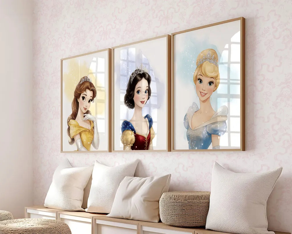 Three framed Disney princess posters of Belle, Snow White, and Cinderella displayed in a row above a bench