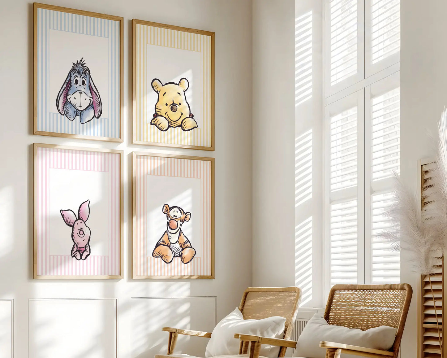 Close up of 4 Winnie the Pooh prints in wooden frames on a nursery wall