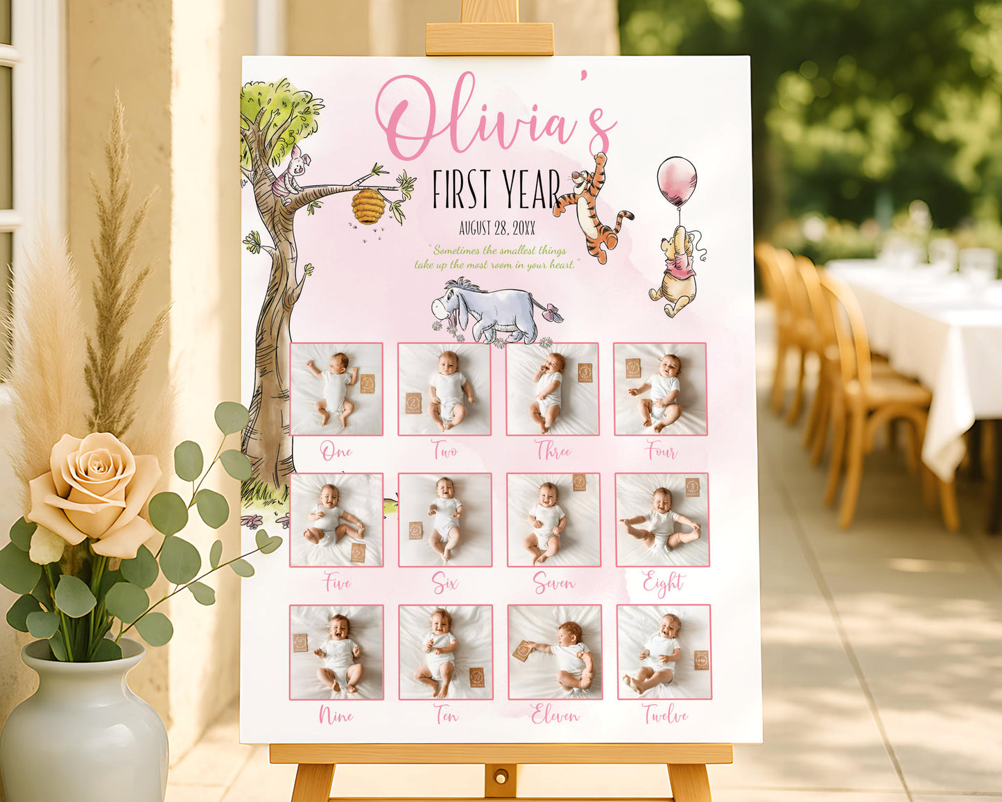 Winnie the Pooh first year photo board featuring a monthly baby photo timeline in a pink theme