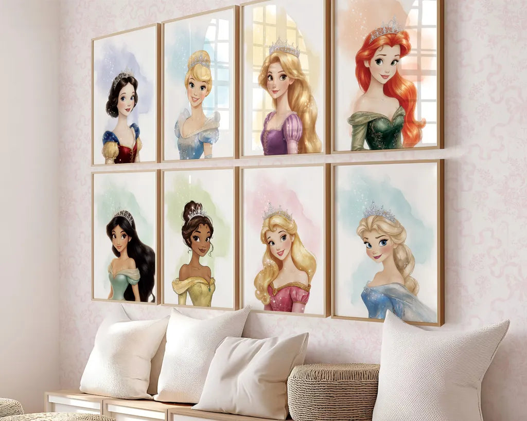 A set of framed Disney princess watercolor wall art prints displayed on a nursery wall above a bench