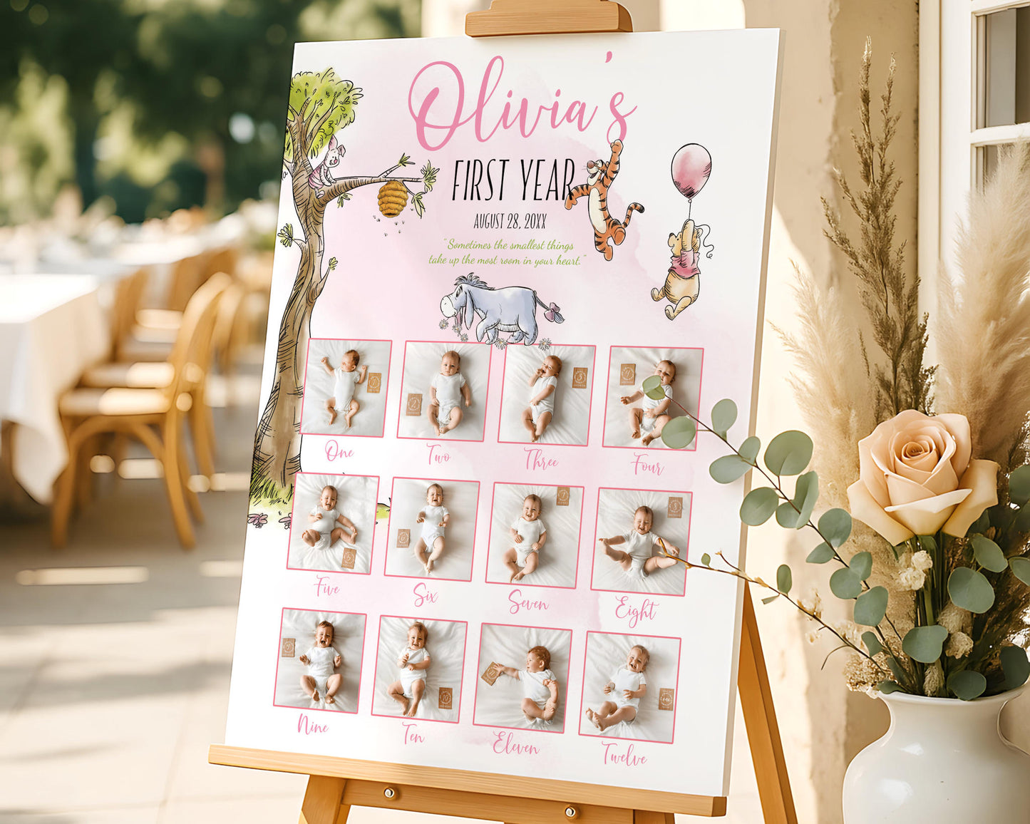 Personalized Winnie the Pooh birthday milestone board with baby monthly photos styled next to flowers