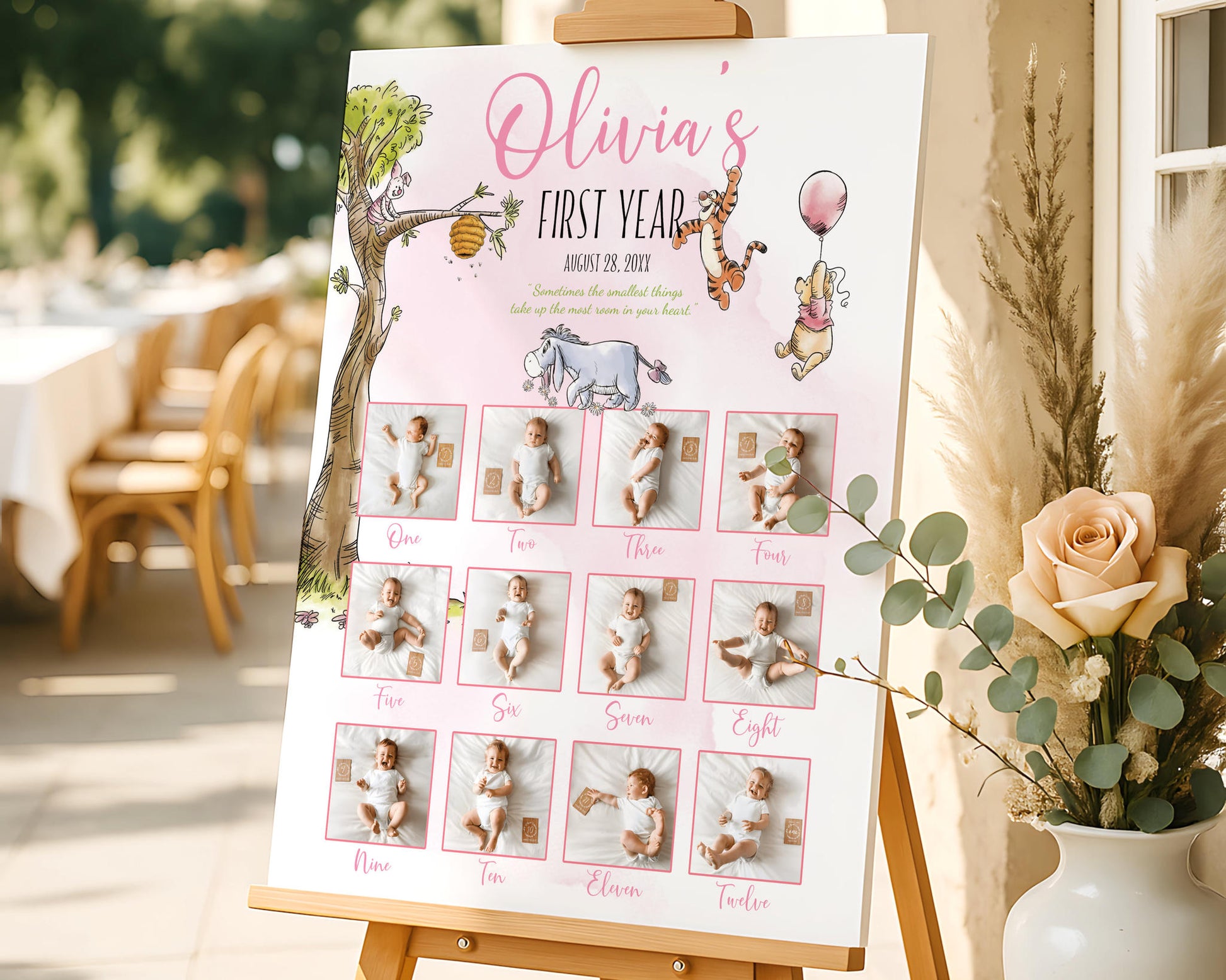 Personalized Winnie the Pooh birthday milestone board with baby monthly photos styled next to flowers