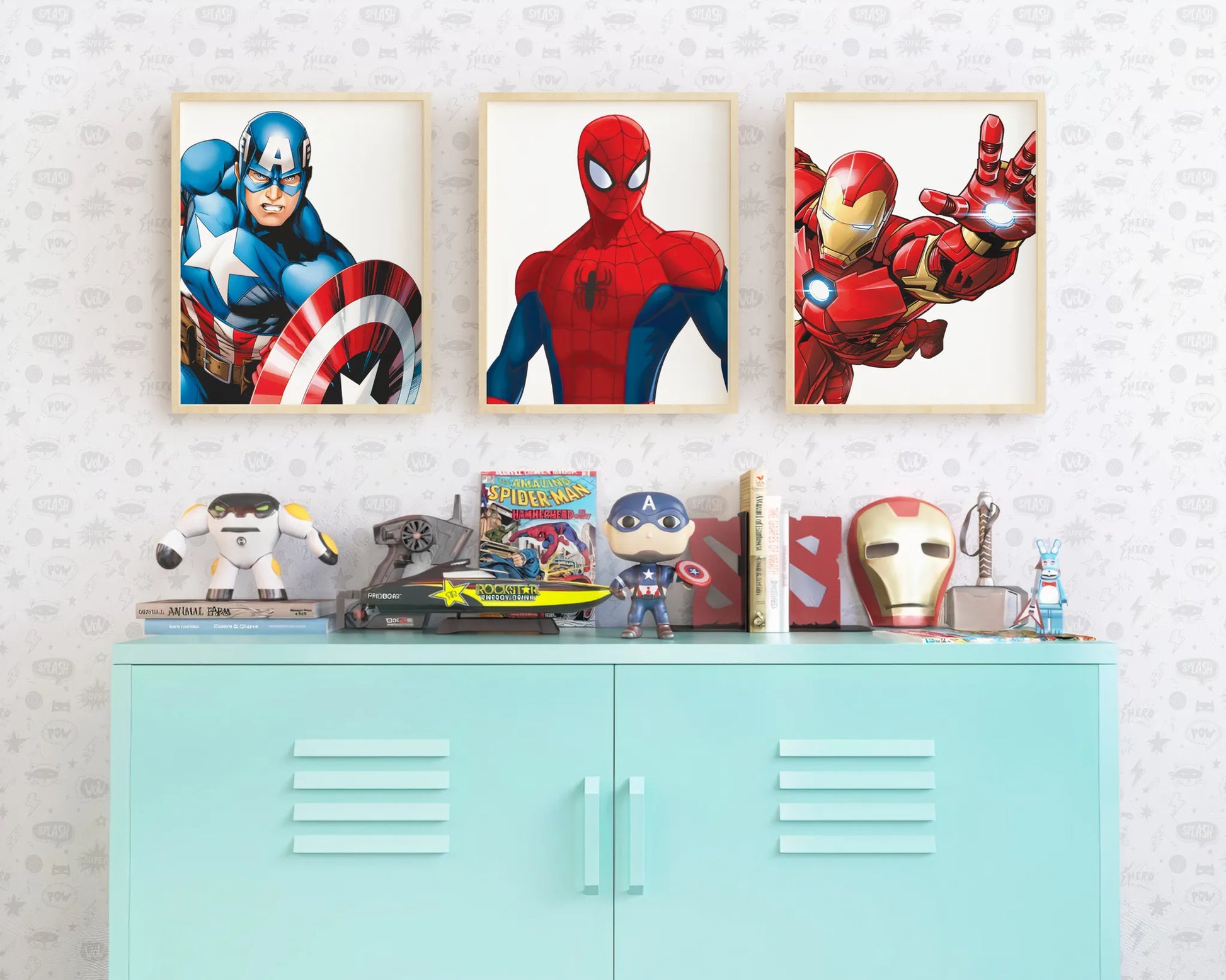 Three superhero prints of Captain America, Spider-Man, and Iron Man styled above a blue cabinet in a boy's room