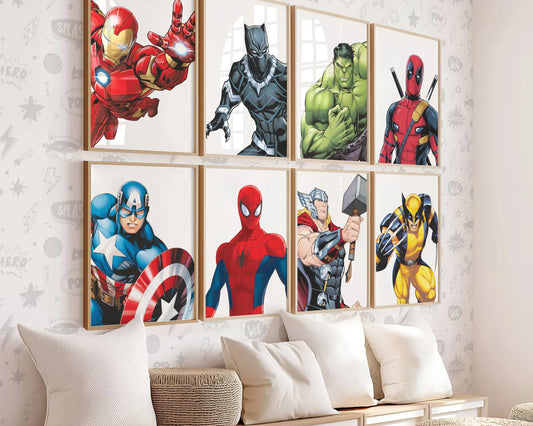 A set of 12 superhero digital prints displayed in frames on a nursery wall featuring popular comic characters