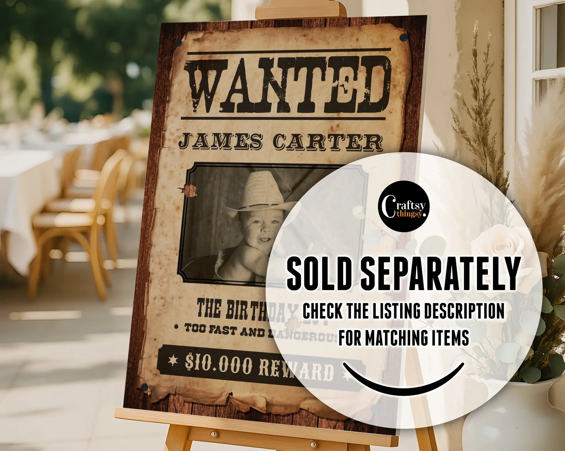 Rustic western party invitation styled as a vintage Wanted Poster with child’s photo, displayed on an easel sign for cowboy birthday decor.