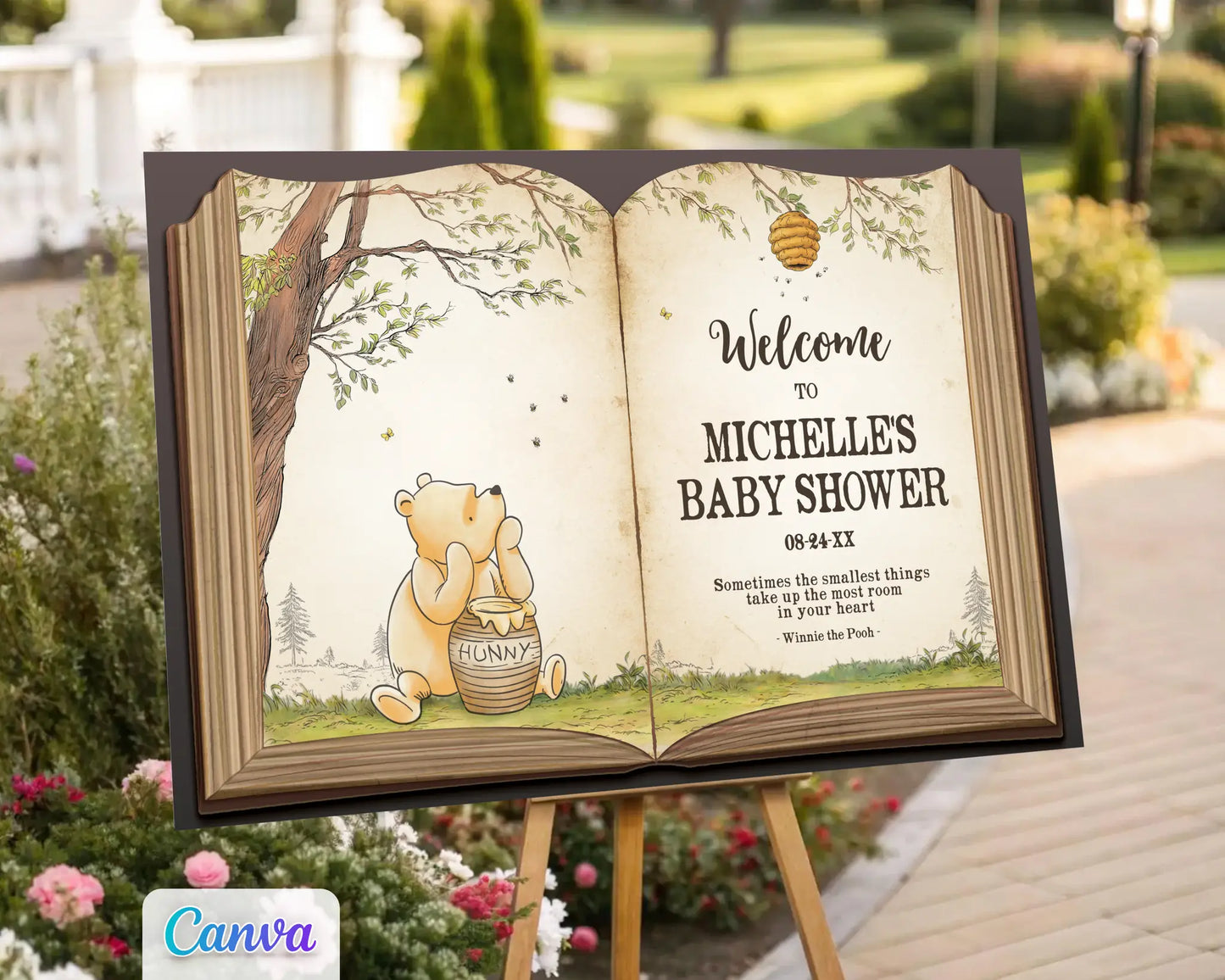 Winnie the Pooh baby shower welcome sign displayed outdoors on an easel surrounded by flowers, featuring Pooh Bear with a honey pot in a storybook design.
