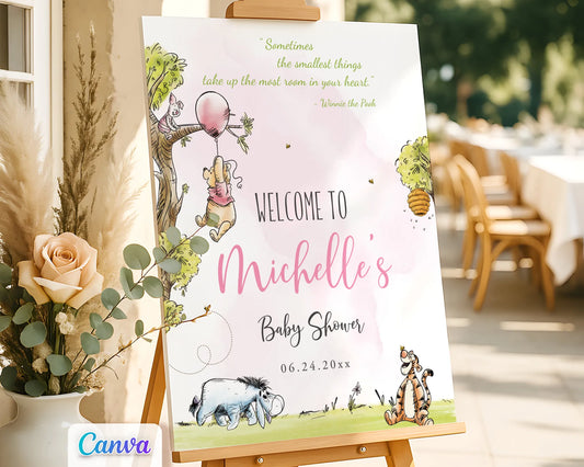 Watercolor Winnie the Pooh baby shower girl welcome sign on an easel in an outdoor setting
