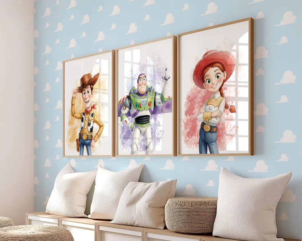 Three framed Toy Story prints of Woody, Buzz Lightyear, and Jessie arranged on a blue cloud pattern wall
